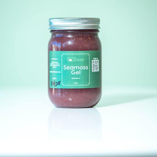 A jar of The Main Squeeze Elderberry Seamoss Gel with a green label and QR code.